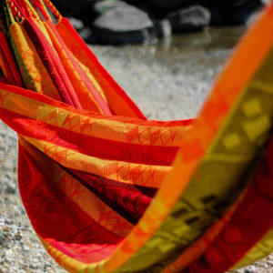 The Kaju handmade hammock is typical of Colombia. With its warm colors like red, yellow or orange. It has native motifs woven entirely by hand.